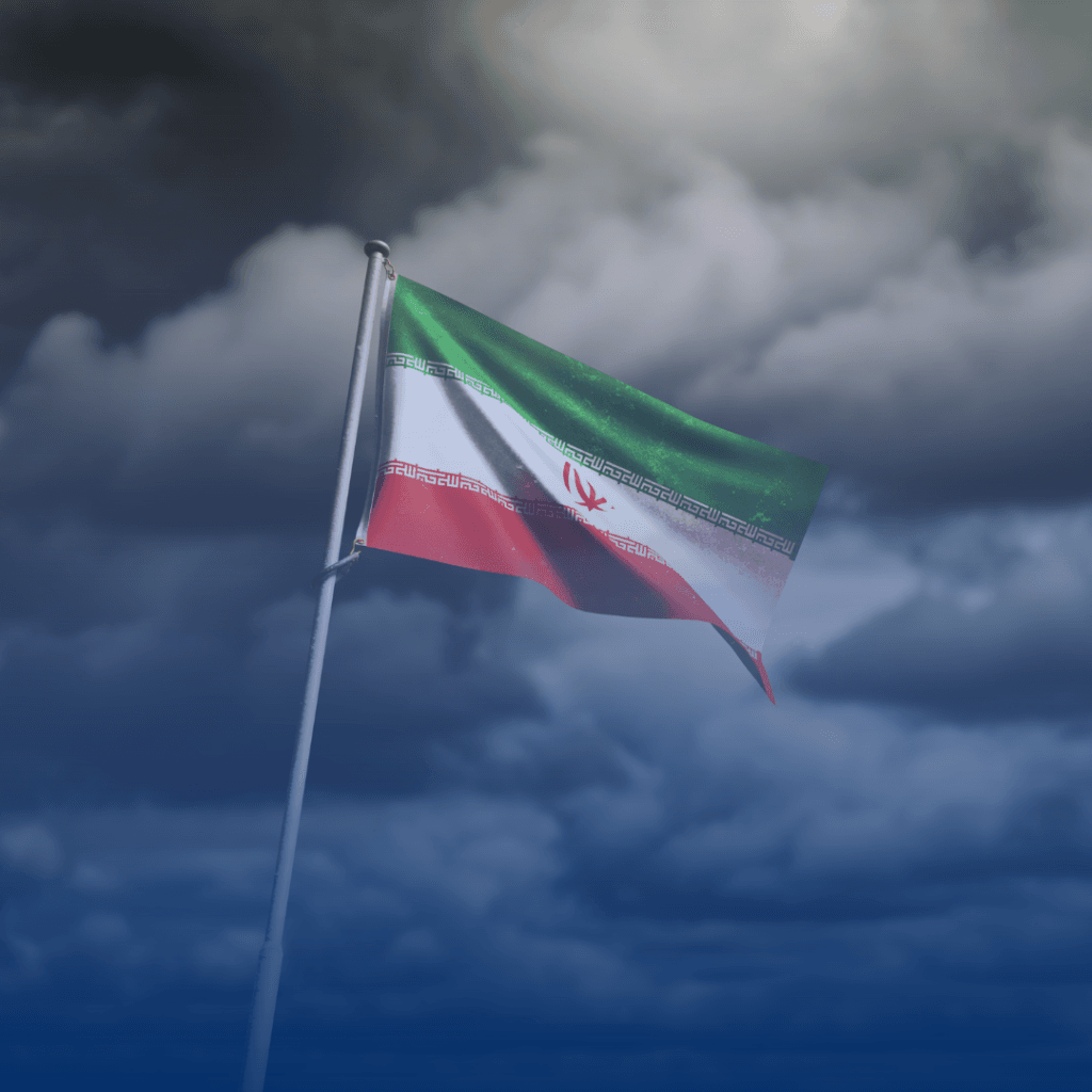 Image of Iranian flag with clouds in the background. (Source: Canva)