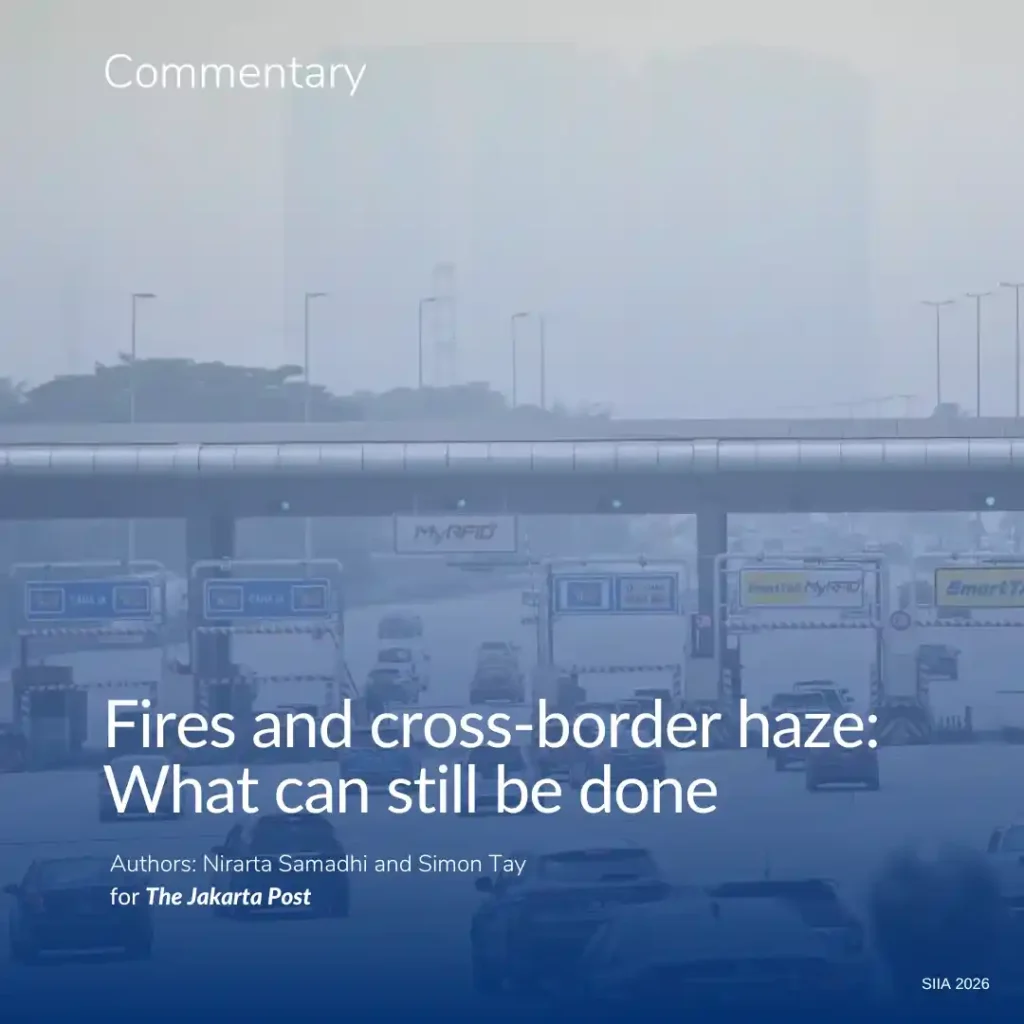 Cars head to a tollgate in Kuala Lumpur on Oct. 9, 2026, a residential building in the distance obscured by thick haze from wildfires in Kalimantan and Sumatra. (AFP/Arif Kartono)